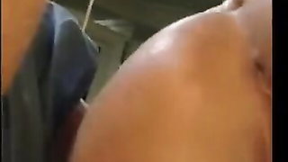 Explicit massage scene in a softly lit room