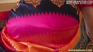 Explicit massage scene in a softly lit room
