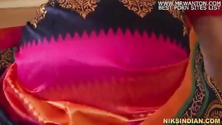 Explicit massage scene in a softly lit room