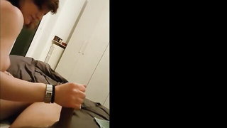 Explicit massage scene in a softly lit room