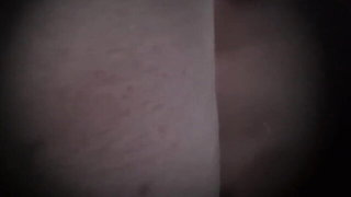 Explicit massage scene in a softly lit room