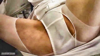Couple on a made bed in an explicit scene