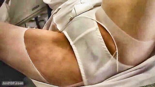 Couple on a made bed in an explicit scene