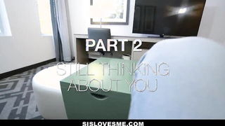 Couple mid-scene in a dim bedroom
