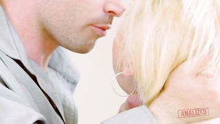 Couple mid-scene in a dim bedroom