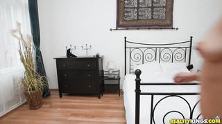 Explicit massage scene in a softly lit room