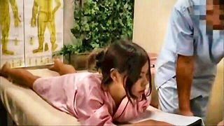 Solo performer with a toy on rumpled bedsheets