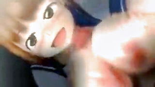 Solo performer with a toy on rumpled bedsheets