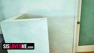 Couple mid-scene in a dim bedroom