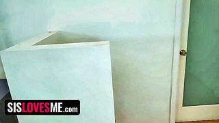 Couple mid-scene in a dim bedroom