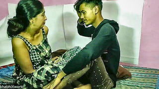 Couple mid-scene in a dim bedroom