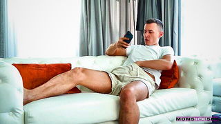 Couple on a made bed in an explicit scene