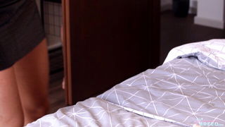 Couple mid-scene in a dim bedroom