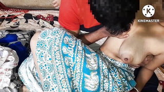 Couple on a made bed in an explicit scene