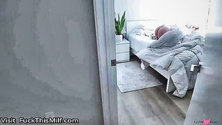 Couple mid-scene in a dim bedroom