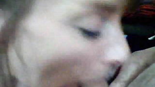 Explicit massage scene in a softly lit room