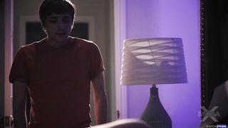 Explicit massage scene in a softly lit room