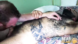 Amateur couple on a living room sofa in explicit scene