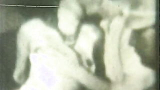 Couple on a made bed in an explicit scene
