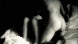 Explicit doggy style scene on a wide bed