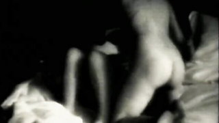 Explicit doggy style scene on a wide bed