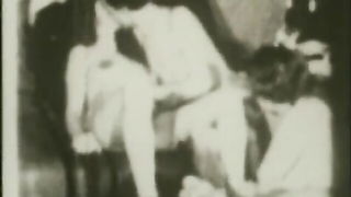 Couple mid-scene in a dim bedroom