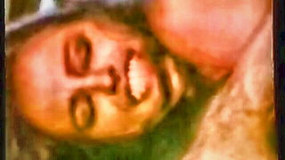 Explicit massage scene in a softly lit room