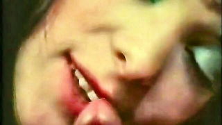 Solo performer with a toy on rumpled bedsheets