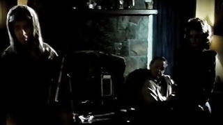 Studio set with performers in an explicit scene under bright lights