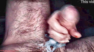 Couple on a made bed in an explicit scene