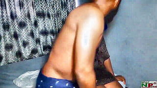 Amateur couple on a living room sofa in explicit scene