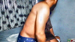 Amateur couple on a living room sofa in explicit scene