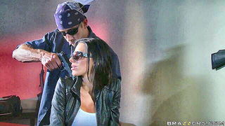 Couple mid-scene in a dim bedroom