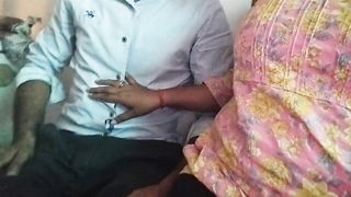 Amateur couple on a living room sofa in explicit scene