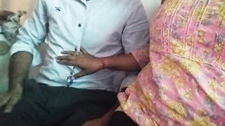 Amateur couple on a living room sofa in explicit scene