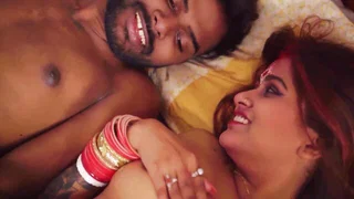 Performers on a leather sofa in a Exotic sex scene