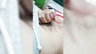 Couple on a made bed in an explicit scene