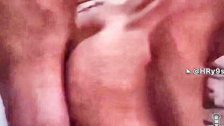 Explicit massage scene in a softly lit room