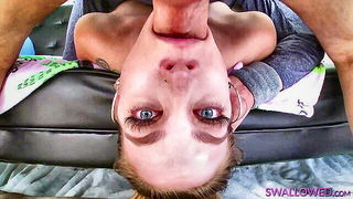 Couple on a made bed in an explicit scene