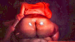 Explicit massage scene in a softly lit room