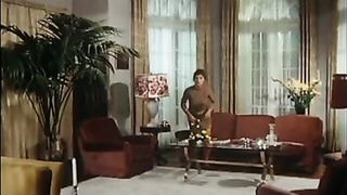 Studio set with performers in an explicit scene under bright lights