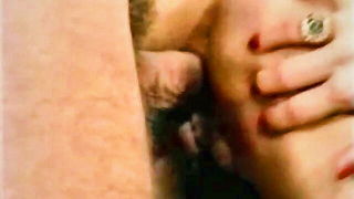 Explicit massage scene in a softly lit room