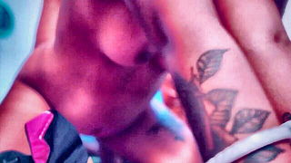 Explicit massage scene in a softly lit room