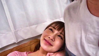 Couple on a made bed in an explicit scene