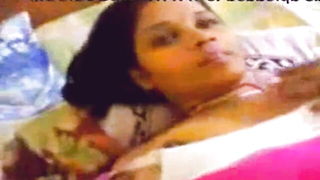 Explicit massage scene in a softly lit room