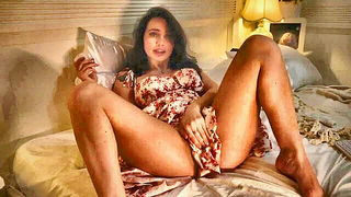 Couple mid-scene in a dim bedroom
