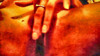 Couple mid-scene in a dim bedroom