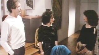 Couple mid-scene in a dim bedroom