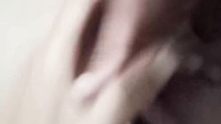 Couple mid-scene in a dim bedroom