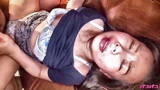 Amateur couple on a living room sofa in explicit scene